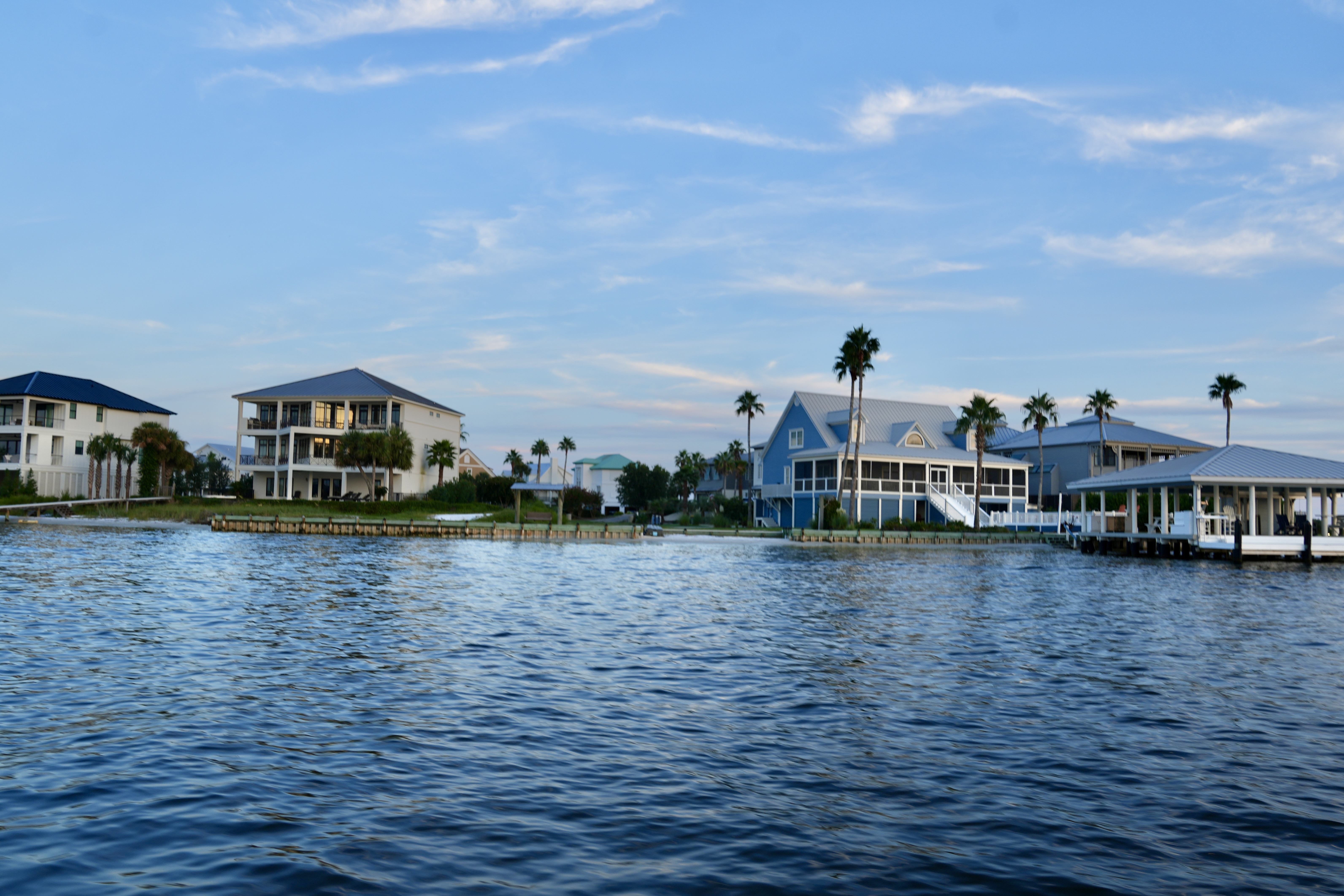 Prestige bayfront living in Ono Island’s Unit Two along Bayou St. John. Homes here showcase screened porches, deep-water docks, and expansive balconies designed to capture stunning sunsets and big-water views — the epitome of Ono Island’s luxury waterfront lifestyle.